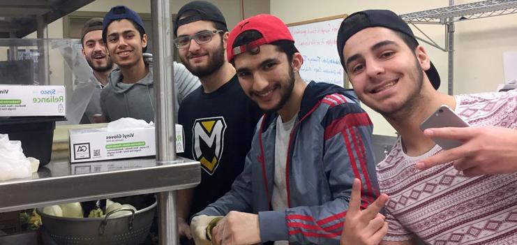 Kurdish students cooking for the international buffet